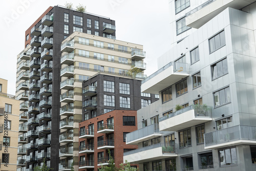 Modern multi-story residential apartment buildings featuring various facade textures, balconies, and contemporary architectural design in the city center of Nieuwegein, Netherlands.