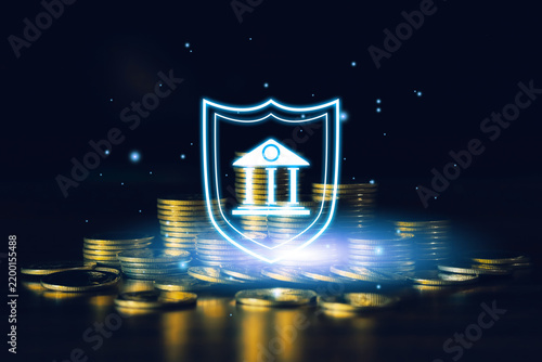 Stacks of gold coins with glowing bank and shield icon represent financial security, safe banking, asset protection, savings, investment, wealth management and economic stability.