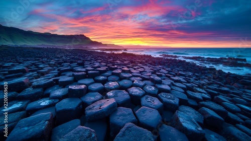 Hexagonal basalt formations stretch to the sea's edge
