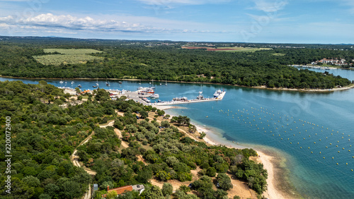 Coastal Marina, Wild Sandy Beach and Boats Along a Turquoise Shoreline Surrounded by Forest, Vabriga, Croatia
