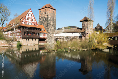 Towers, timbered houses over the river, Nuremberg, Germany. 