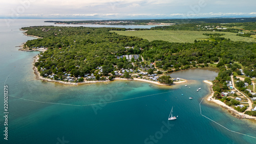 Aerial View of Beautiful Forested Coastline With Boats and Village in Summer, Vabriga, Croatia