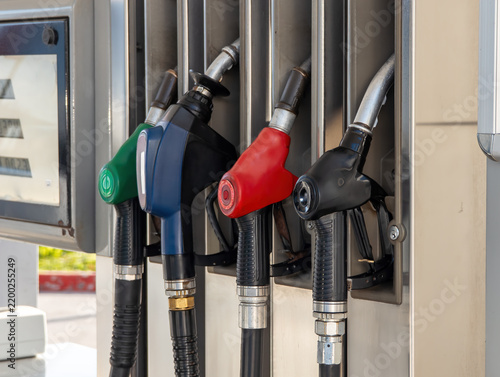 Canvastavla Colorful fuel pump nozzles at gas station closeup, petrol diesel refilling dispe
