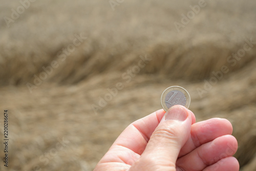 Fotografie Euro coin in a hand