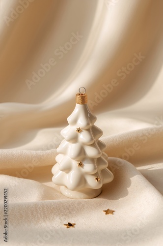 White Ceramic Christmas Tree on Fabric With Stars