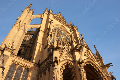 Metz Cathedral at sunset with Gothic portal, rose window, towers and stained glass, known as the Lantern of God, France