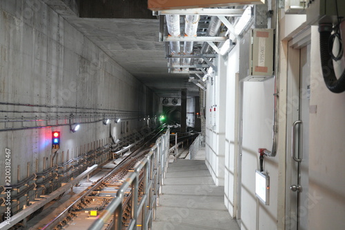An underground subway train tunnel with railway tracks.