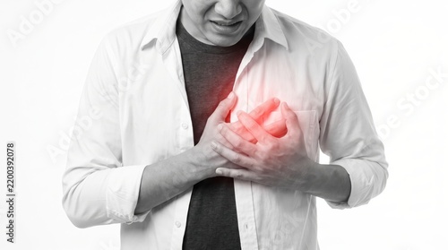 Man suffering from acute chest pain holding his heart in medical emergency health crisis concept