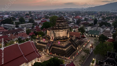 sunset time chiang mai city center famous old temple complex exterior aerial timelapse panorama 4k thailand