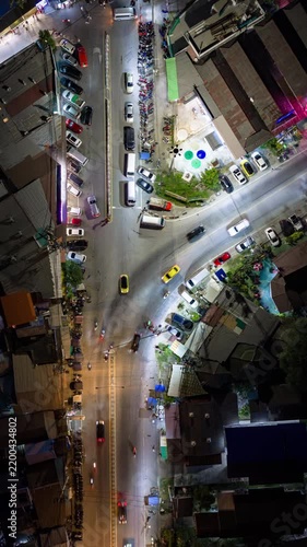 night life time flight over phuket island rawai beach bay traffic street crossroad junction aerial topdown vertical panorama 4k timelapse thailand 
