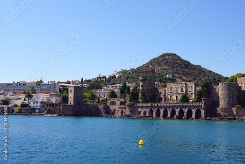 Historic castle on Mediterranean coast with sea and mountain
