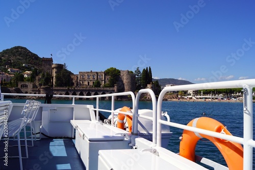 Boat deck overlooking historic castle on the Mediterranean coast