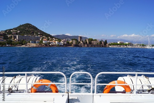 Boat trip overlooking historic castle on the Mediterranean coast