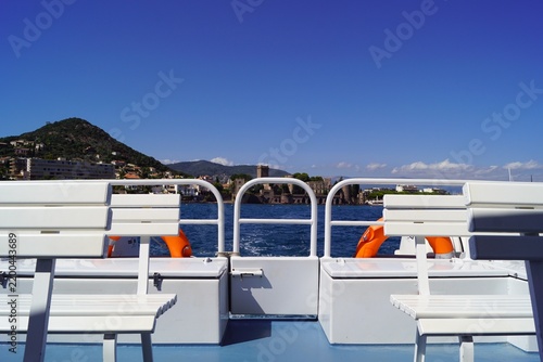 Boat deck overlooking historic castle on the Mediterranean coast