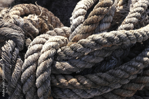 Weathered coiled rope with rough fibrous texture