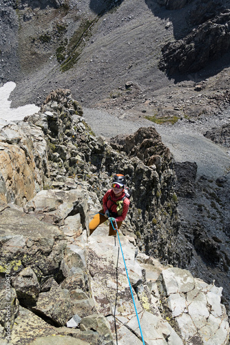 Woman Rappelling Off Devils Crag Number 9 In The Sierra Nevada Mountains