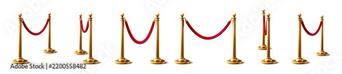 Golden stanchions with red velvet rope on white background