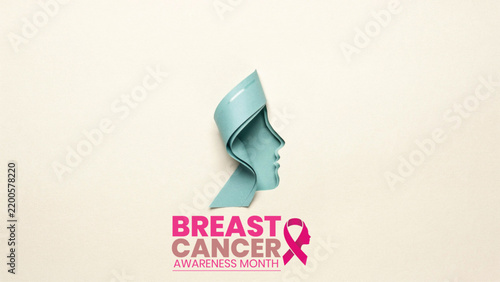 Conceptual image of a woman silhouette with a pink ribbon for breast cancer awareness month campaign