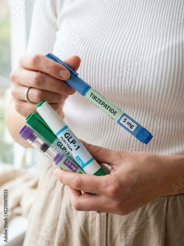Woman Holding Multiple GLP-1 and Tirzepatide Injection Pens for Weight Loss and Diabetes Treatment