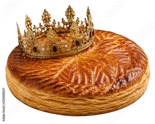 Golden crown placed on top of flaky baked pastry with intricate ridges