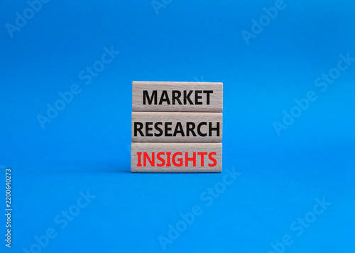 Market research insights symbol. Concept word Market research insights on wooden blocks. Beautiful blue background. Business and Market research insights. Copy space