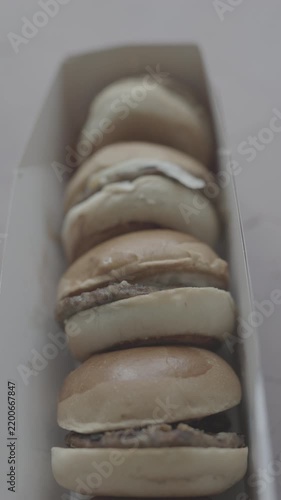 mini burgers or sliders served on a stylish wooden board