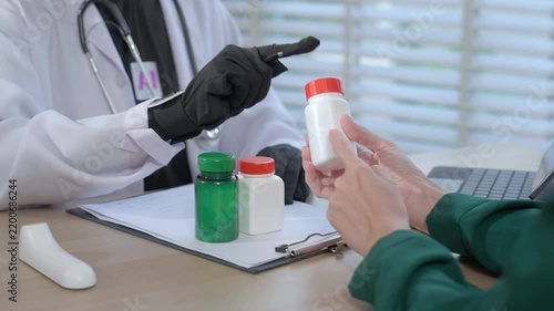 Stock concept of a faceless AI medical provider in a lab coat explaining prescription medicine to a client, virtual healthcare setting, automated pharmaceutical advice, digital health.