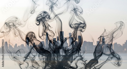 Abstract double exposure smoke art with dark tones and flowing patterns