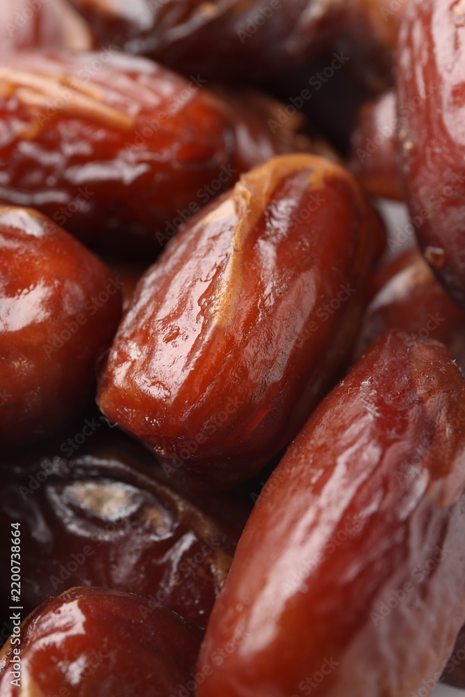 Obraz premium Pile of tasty dried dates as background, closeup