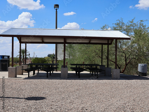 Outdoor Picnic Pavilion With Metal Roof and Shaded Seating Area