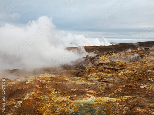 Cloudy and rainy day. Steam vents of Gunnuhver Hot Springs. Mysterious, active geothermal area with volcanic craters and mud pools. Möðruvellir, Möðruvallavegur, Reykjanes Peninsula, Iceland.