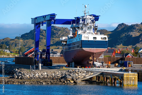 Fishing vessels and shipyard in Ballstad harbor on the Lofoten Islands, Norway