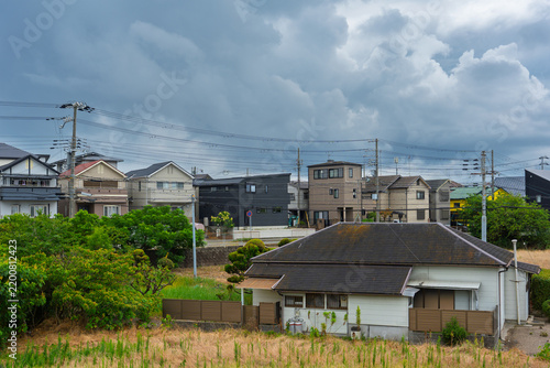 Storm clouds gather over suburban houses in quiet residential area