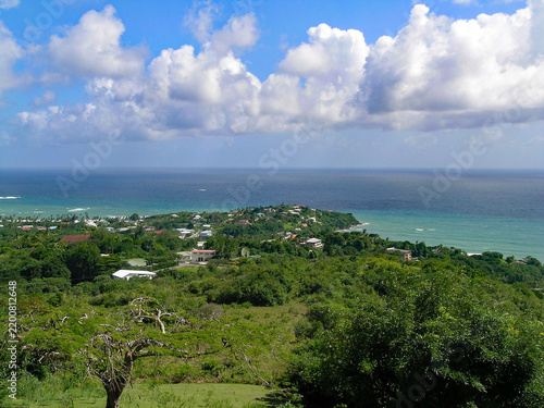 Canvastavla An elevated viewpoint overlooks lush tropical hillsides and coastal settlements