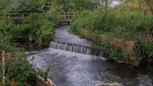 Long time exposure of a small weir on a southern England chalk stream.