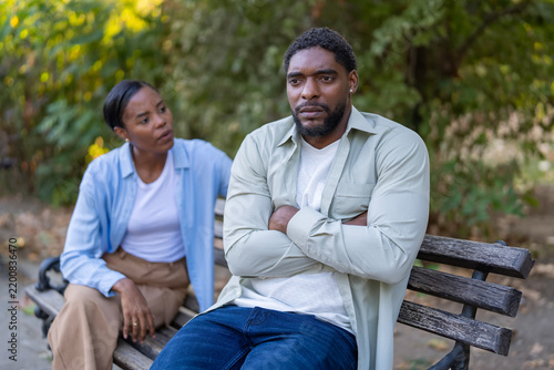 Upset man ignoring partner during relationship problems