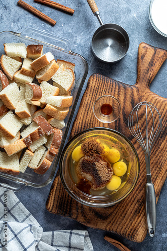 A mixing bowl filled with custard ingredients for making French toast.