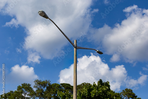 lamp post against blue sky