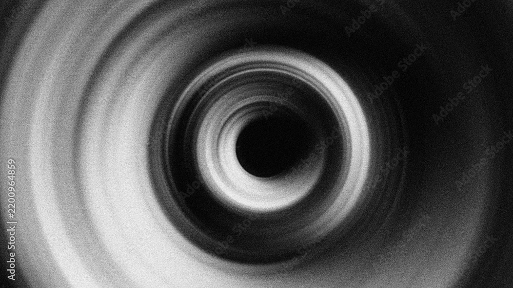 Fototapeta premium Monochromatic concentric rings with a grainy blur texture create a hypnotic radial effect, perfect for abstract motion backgrounds