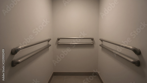 Empty modern bathroom interior with towel racks