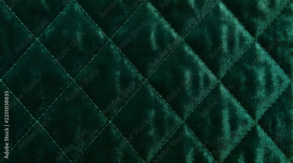 Naklejka premium Luxurious dark green quilted velvet fabric texture background.
