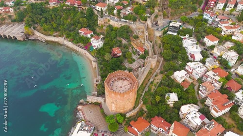 Alanya, Turkey. Kizilkule Red Tower, octagonal stone roof and historic harbor walls, top-down vertical drone view over turquoise Mediterranean waters. Aerial View, MasterShots, Rocket