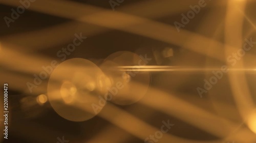 Golden light flares with abstract organic curves moving through darkness cinematic