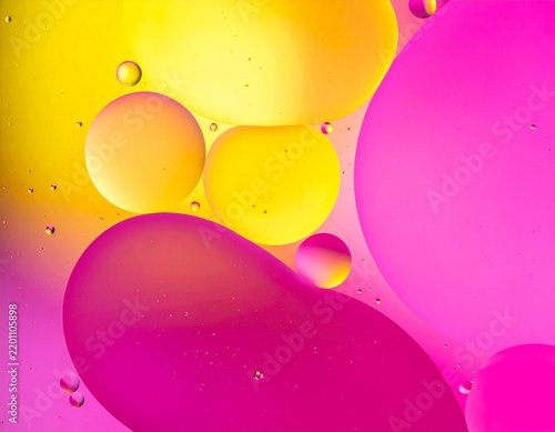 Colorful oil droplets floating on water surface
