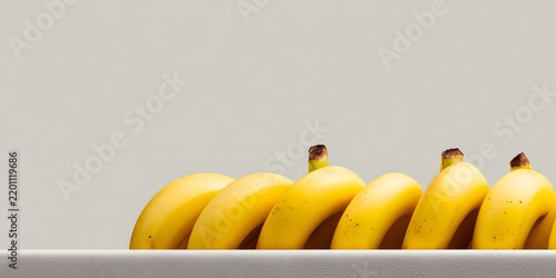 A bunch of ripe yellow bananas sitting in a white bowl