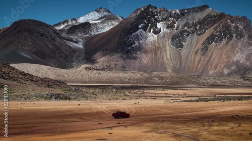 Aerial drone footage of a 4x4 vehicle in the mountains of Suriplaza, Chile. High quality 4k footage