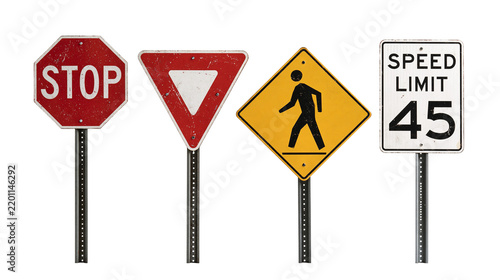 Weathered metal road signs including stop yield pedestrian crossing and speed limit