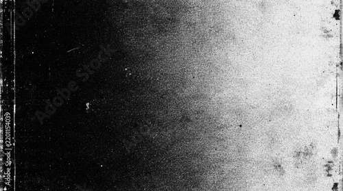 Abstract black and white grainy textured background fading