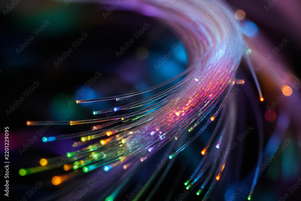 Fototapeta premium Abstract digital art featuring flowing, colorful light trails against a dark background.
