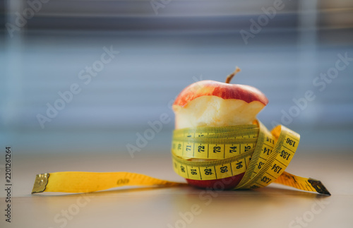 Apple with Measuring Tape Representing Healthy Diet, Weight Loss, Fitness, Nutrition, Slim Lifestyle and Fresh Fruit for Health and Wellness Concepts